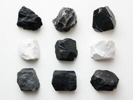 Collection of black and white stones arranged in a grid pattern photo