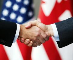 Diplomatic handshake between representatives of two nations photo