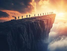 People walking along a cliff at sunset with dramatic clouds photo