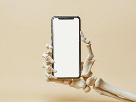 Smartphone held by a skeletal hand against a neutral background photo