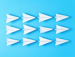 Ten paper airplanes arranged on a blue background for fun exploration photo