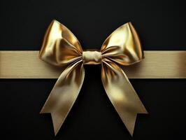 Elegant golden bow resting on a black background for gift wrapping or decoration purposes during festive occasions photo