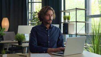 Arabian middle eastern ethnic man businessman programmer software coder office worker executive manager employer entrepreneur working with laptop computer business corporation looking at camera smile video