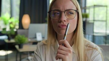 Portrait thoughtful puzzled girl student Caucasian businesswoman in glasses think business idea creative thoughts doubtful woman ponder solution solve problem in office brainstorm difficult question video