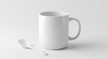 A white mug and spoon on a white surface photo