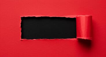 Black hole in red paper background with copy space photo