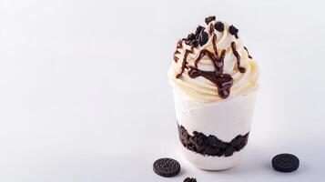 An oreo ice cream sundae with chocolate and whipped cream photo