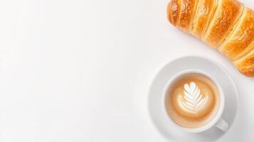 Cup of coffee and croissant on white background top view photo