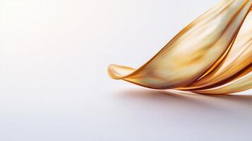 A golden liquid flowing over a white surface photo