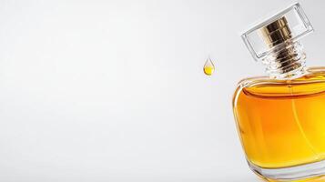 A bottle of perfume with a drop of liquid photo