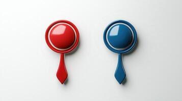 Two red and blue spoons on a white surface photo
