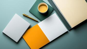 A coffee cup, pen and notepad on a desk photo