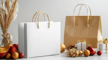 White shopping bags with gold and red decorations on a table photo