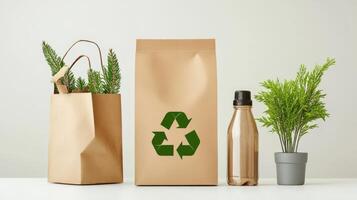Paper bag with recycling symbol, bottle and plant on white background photo