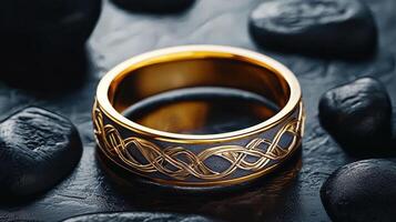 A gold ring with a celtic design on it photo