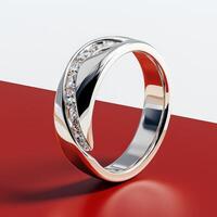 A diamond ring on a red and white surface photo