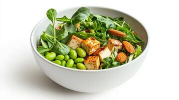 A bowl of salad with tofu, spinach, and almonds photo