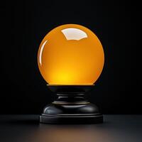 An orange ball on a black table photo
