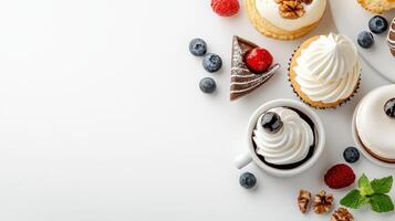 Various cupcakes and desserts on white background photo