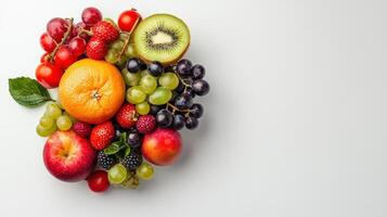 Fresh fruit and vegetables arranged in a circle on a white background photo