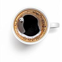 A cup of coffee with black liquid on top photo