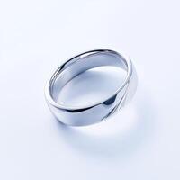 A silver wedding ring on a white background photo
