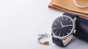 A watch and a purse on a white surface photo