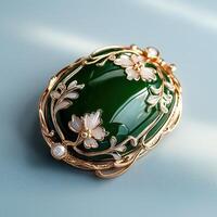 A green stone brooch with gold accents photo
