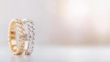 Two gold and silver wedding rings on a table photo