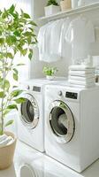 A white laundry room with a washer and dryer photo