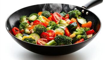 A wok filled with vegetables and spices photo