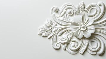 A decorative white flower is shown on a wall photo