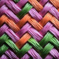 A close up of a woven fabric with colorful yarn photo