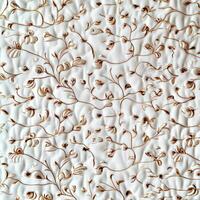 A close up of a white wall with a floral design photo