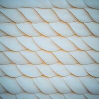 A white wall with a pattern of wavy lines photo