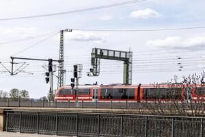 Railway bridge and high-speed train across the Elbe River, Dresden, Germany photo