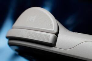Close up of game console button switch. Gray portable pocket modern game console retro style design photo