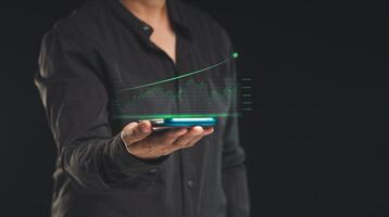The growth of a business is displayed as a virtual graph on a smartphone's screen photo