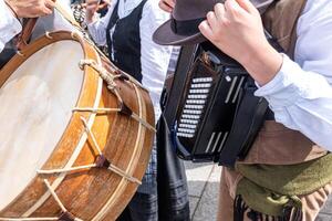 percussion and accordion players in a cultural event. musicians playing traditional folk music during a popular festival in Galicia photo