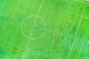 drone top view photography of a synthetic turf sports field overhead view of a soccer football pitch layout photo