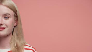Half portrait of woman with pink background video