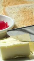 take a frozen cube of butter and put it on the toast next to strawberry jam video
