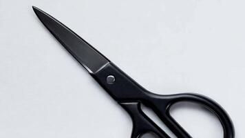Close-up view of a sharp knife blade resting on a light surface in a kitchen setting, showcasing its sleek design and craftsmanship video