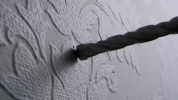 Close-Up of a Twisted Metal Tool Engraving Intricate Patterns on a Textured Surface in Artistic Craftwork video
