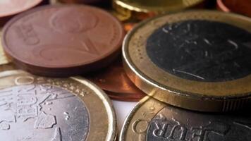 Close-Up View of Euro Coins Stacked and Scattered on a Smooth Surface in Macro Shot video