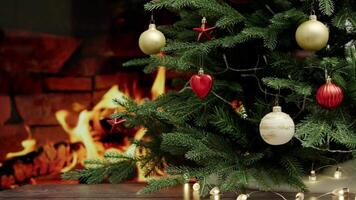 Cozy Christmas Tree Adorned with Ornaments and Lights by a Warm Fireplace Setting video