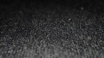 Intricate Macro Shot of Dark Textured Fabric Surface Highlighting Abstract Weave Patterns video
