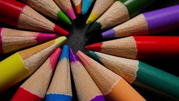 Vibrant Colored Pencils Arranged in a Circle on Black Background for Drawing video