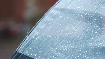 Close-up of transparent umbrella covered with raindrops in a rainy outdoor environment capturing weather details video
