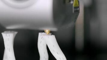 A close-up shot of a 3D printer extruding material to create a complex object, showcasing modern additive manufacturing. video